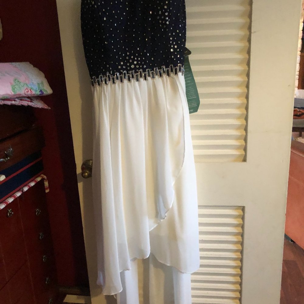 Junior formal dress with strapless navy top with rhinestones, white hi low skirt